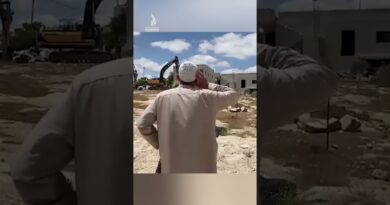 Palestinian man recites call to prayer in front of Israeli bulldozers