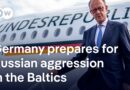 Chancellor Merz in Lithuania to mark deployment German military unit | DW News
