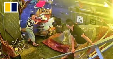 Chinese boy holds food counter as strong winds hit parents’ restaurant