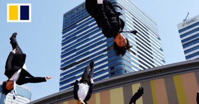 Japanese salarymen find joy in cheerleading