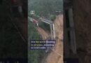 Truck driver trapped mid-air after bridge collapses amid floods in China #shorts