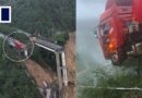 Truck driver trapped mid-air after bridge collapses amid floods in China
