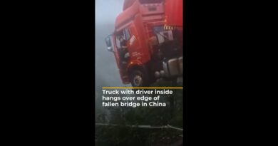 Truck with driver inside hangs over edge of fallen bridge in China | AJ #shorts