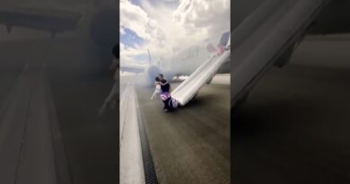 Passengers Evacuate Smoky Plane in Denver