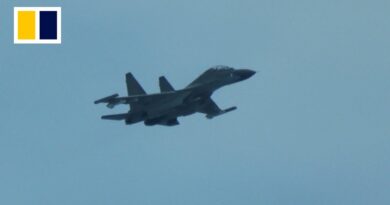 Chinese fighter jet flies close to Philippine coastguard plane in South China Sea
