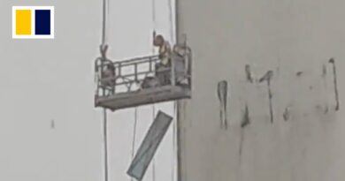 Construction workers trapped mid-air as rainstorm hits China