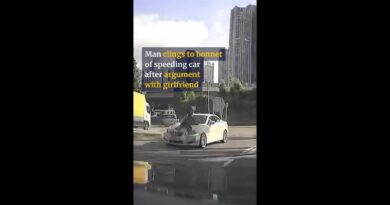 Man clings to bonnet of speeding car after argument with girlfriend