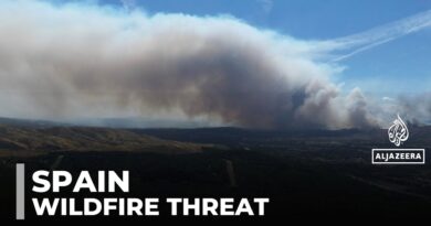 Spain wildfires burn vast land as temperatures drop but risks remain high