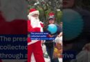 Santa Claus sweeps down from bridge to deliver gifts in Guatemala