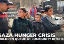 Gaza children queue at community kitchens for their families’ only daily meal