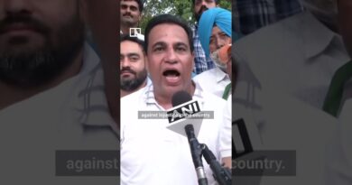Protesters celebrate after India’s education minister quits