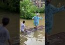 Residents ride floodwaters in northern China