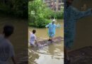 Residents ride floodwaters in northern China