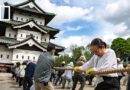 Watch 1,800 people move an entire castle in Japan